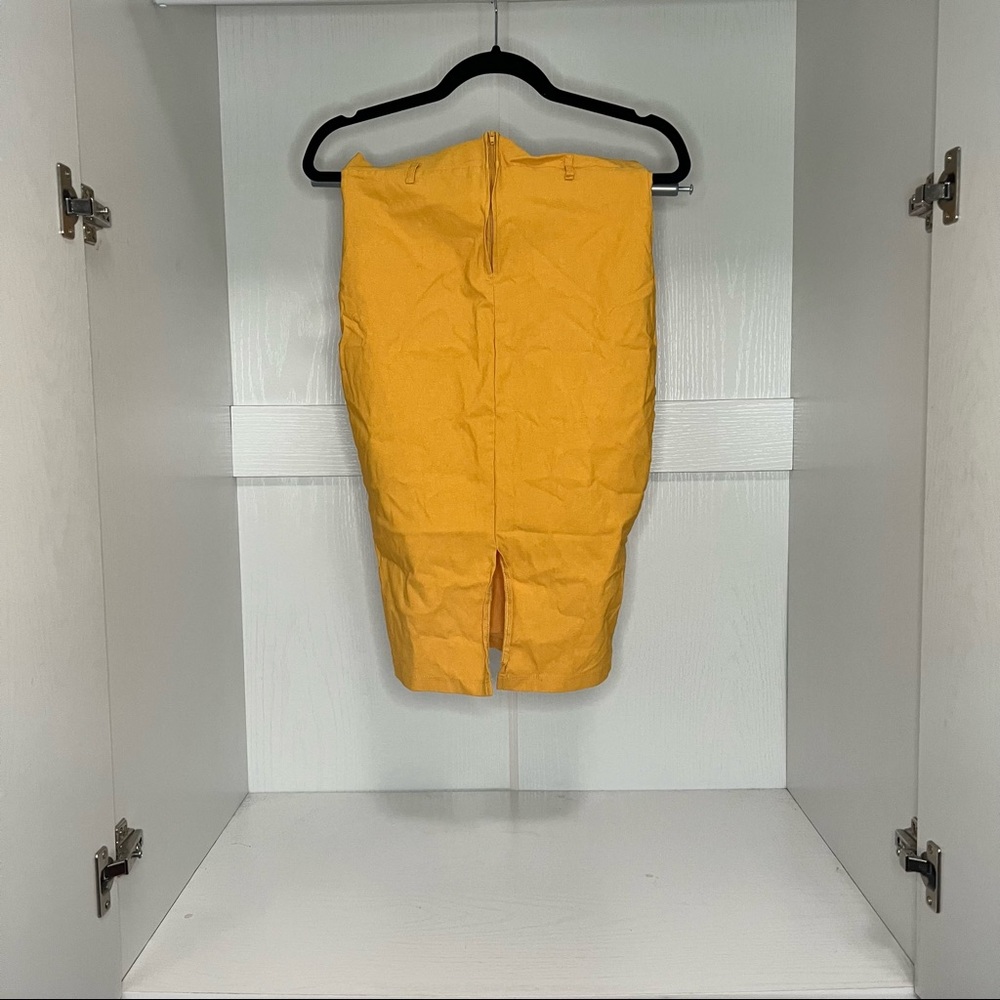 Two skirts one yellow one blood orange . Pencil skirt. Good stretch.